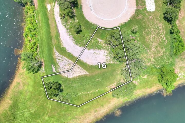 Property Photo:  133 Tranquil Mirror Lake Court Lot 16  FL 34711 