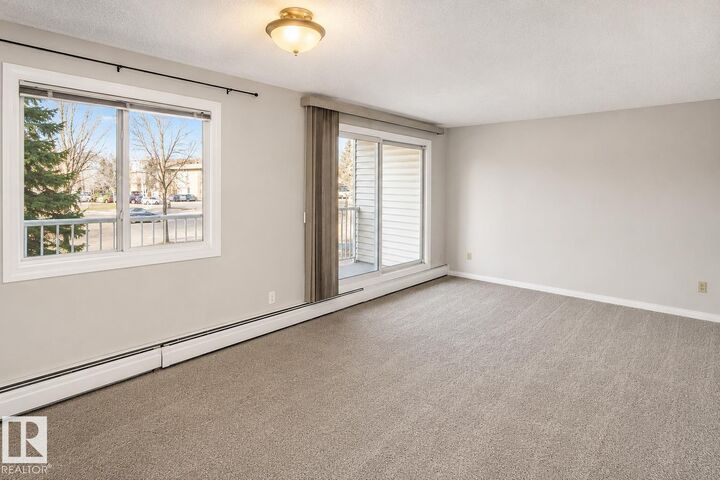 Property Photo: 5125 Riverbend Road NW 223 AB T6H 5K5