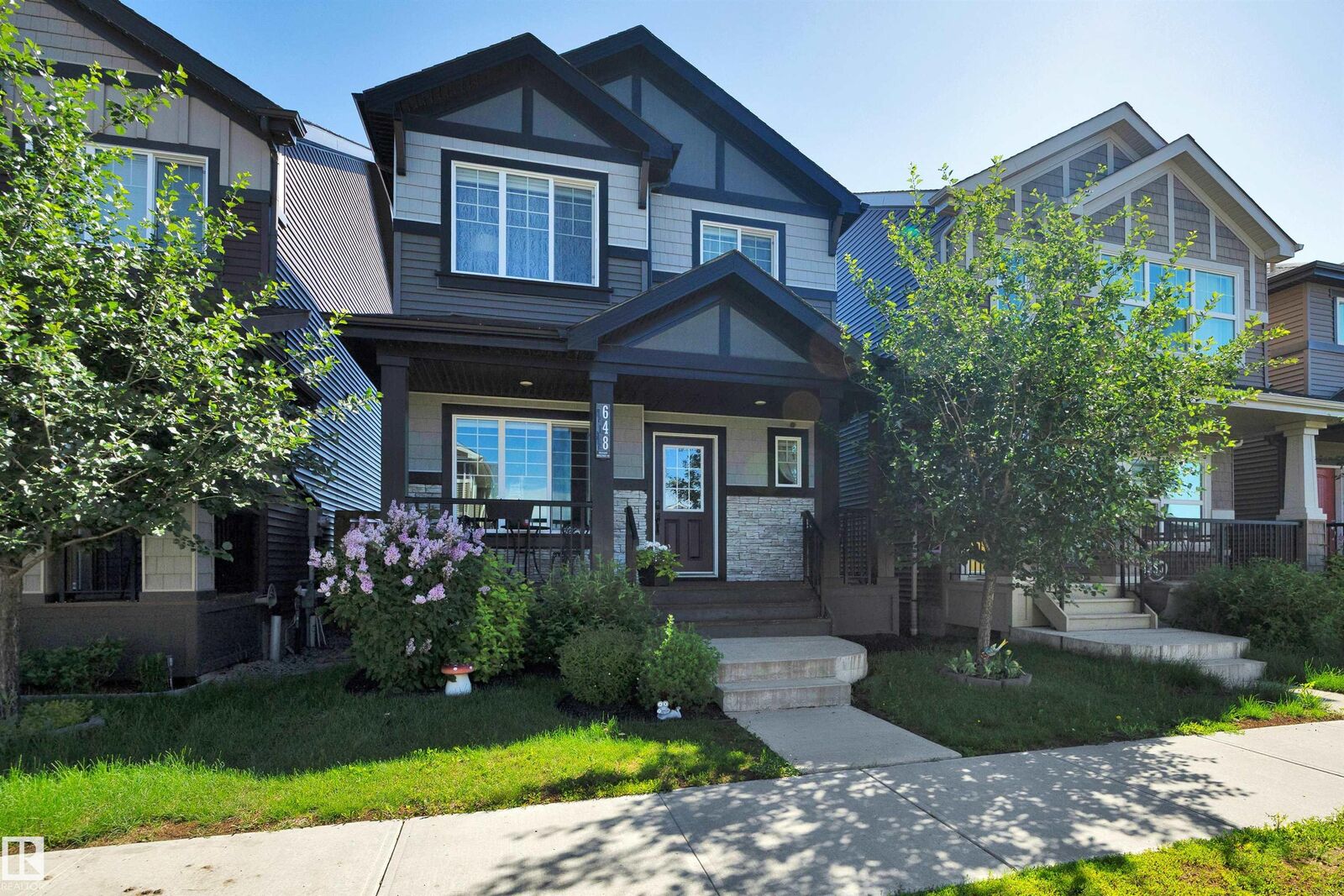 Property Photo: 648 Orchards Boulevard SW AB T6X 2L4