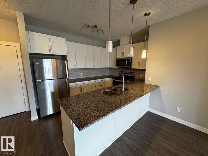 Property Photo: 3670 139 Avenue NW 405 AB T5Y 3N5