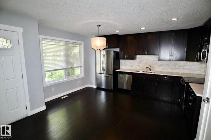 Property Photo:  12207 96 Street NW 1  AB T5G 1W2 