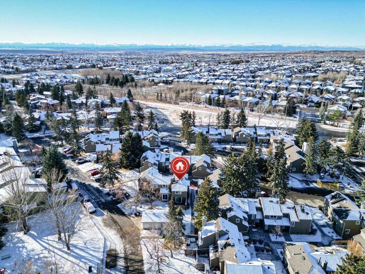 Property Photo: 829 Coach Bluff Crescent SW 1101 AB T3H 1B1