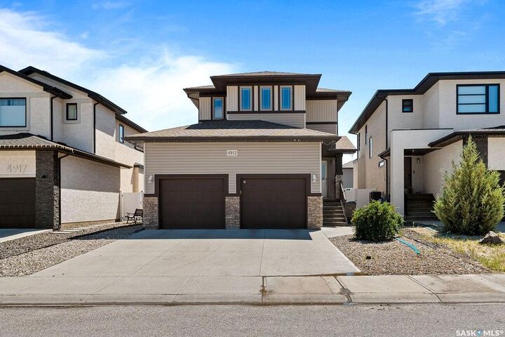 Property Photo:  4913 Green Brooks Way E  SK S4V 3K5 