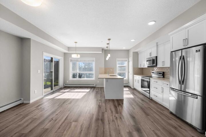 Property Photo: 360 Harvest Hills Common NE 107 AB T3K 2N1
