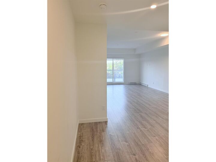 Property Photo:  E305 10829  140 St  BC V3R 0H4 