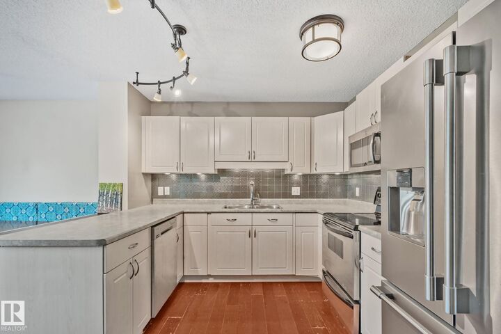 Property Photo:  12248 16 Avenue SW  AB T6W 1L7 