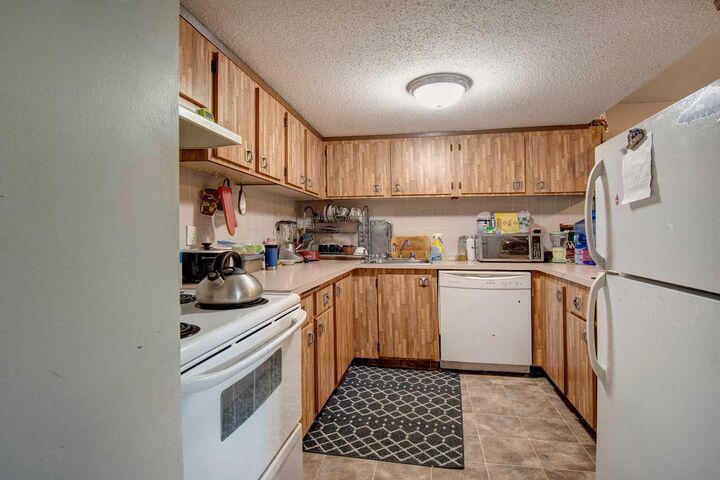 Property Photo: 2200 Woodview Drive SW 106 AB T2W 3N6