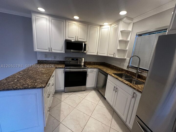 Property Photo:  7671 W Courtyard Run W  FL 33433 