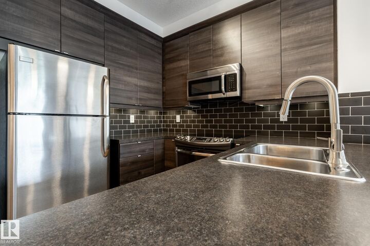 Property Photo: 2590 Anderson Way SW 215 AB T6W 0R2