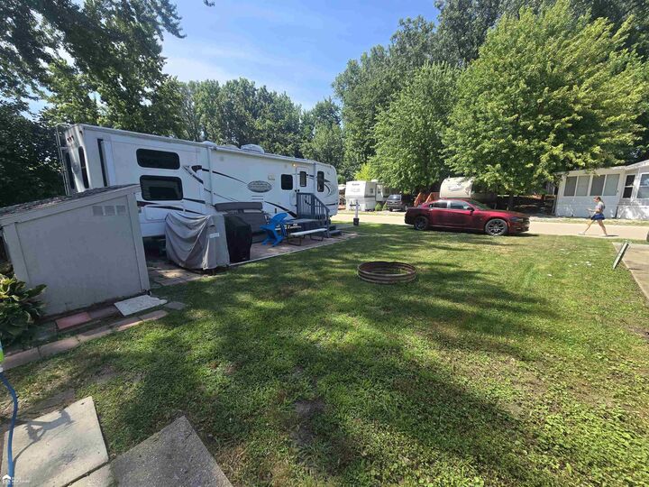 Property Photo:  10001 Goodall Road 57  MI 48429 