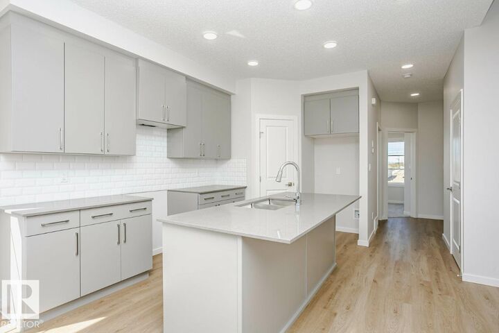 Property Photo: 303 Edgemont Drive NW AB T6M 3G7