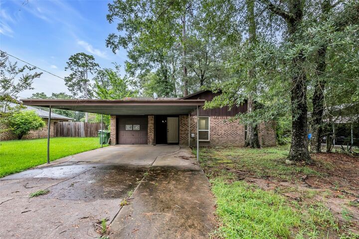 Property Photo: 1303 S Fenner Avenue TX 77327