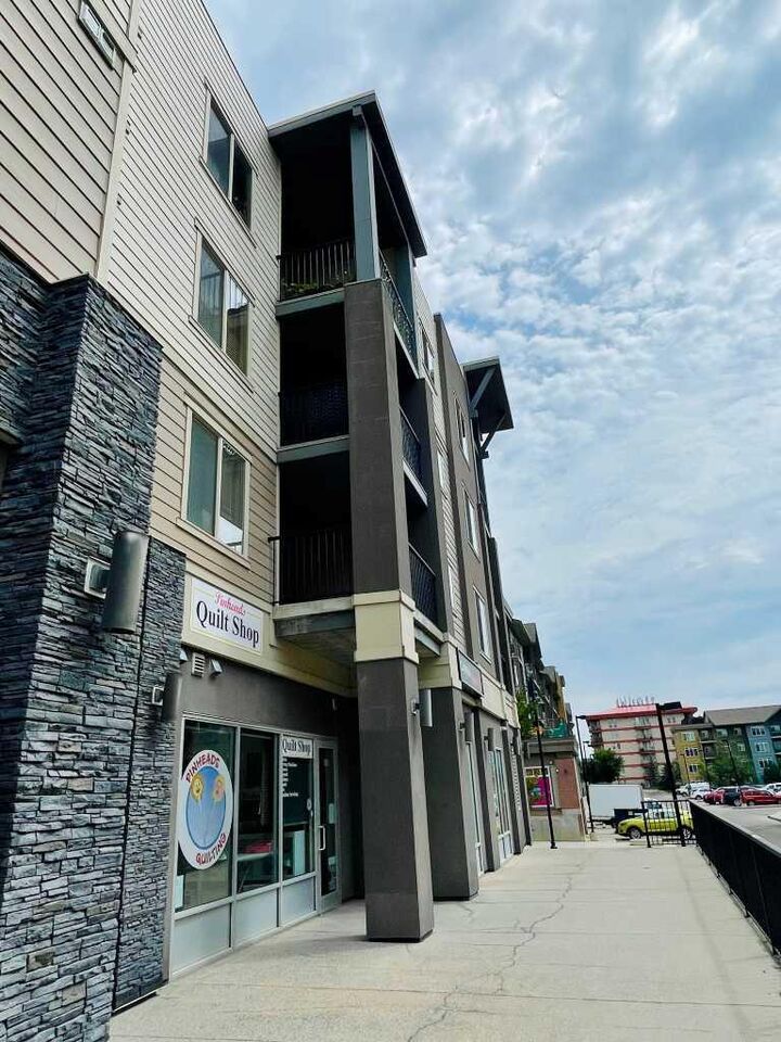 Property Photo:  403 Mackenzie Way SW 6210  AB T4B 3V7 