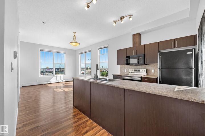 Property Photo: 105 Ambleside Drive SW 406 AB T6W 0J4