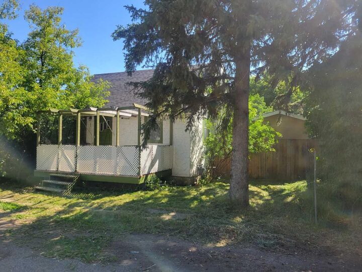 Property Photo: 1 Elm Avenue AB T1S 1K6