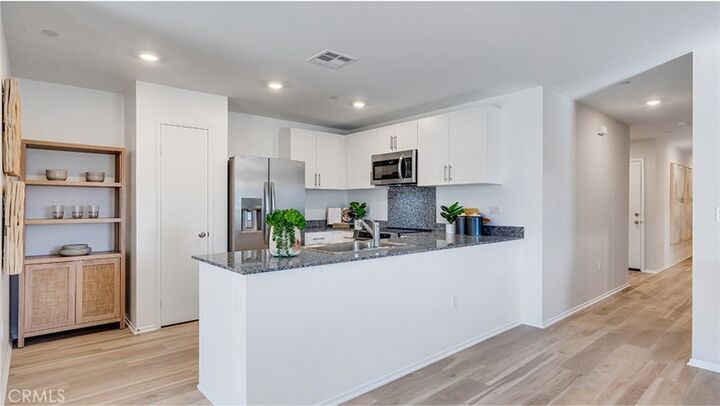 Property Photo:  7582 Vassar Avenue  CA 92345 
