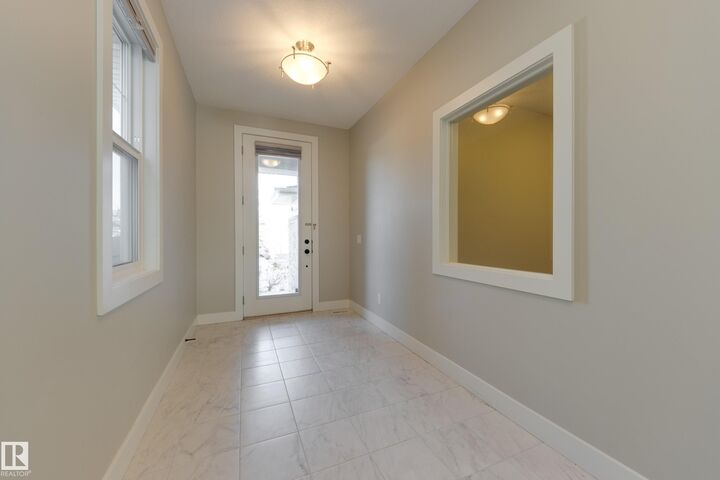 Property Photo:  7473 Colonel Mewburn Road NW  AB T5E 6V5 