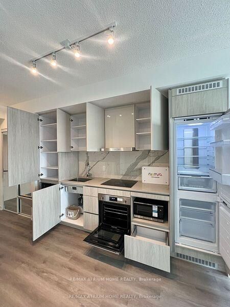 Property Photo: 28 Interchange Way 1707 ON L4K 0P8