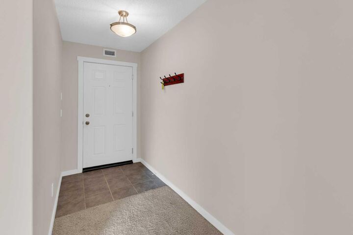 Property Photo: 141 Mountain Street 304 AB T4C 1Z5