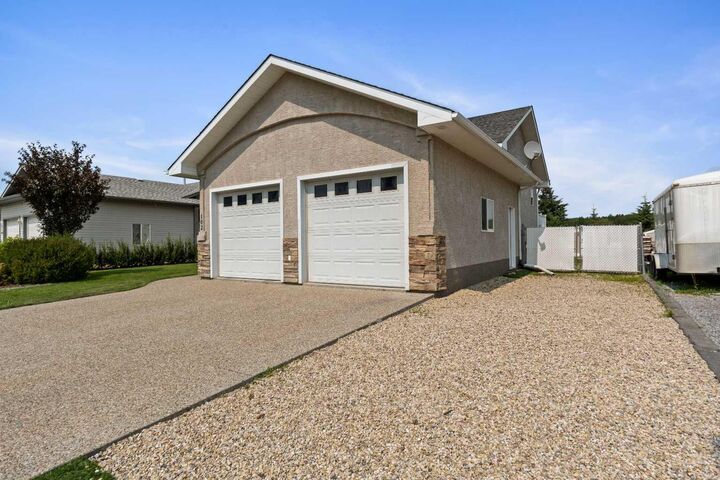 Property Photo: 102 Poplar Drive AB T7S 1W7