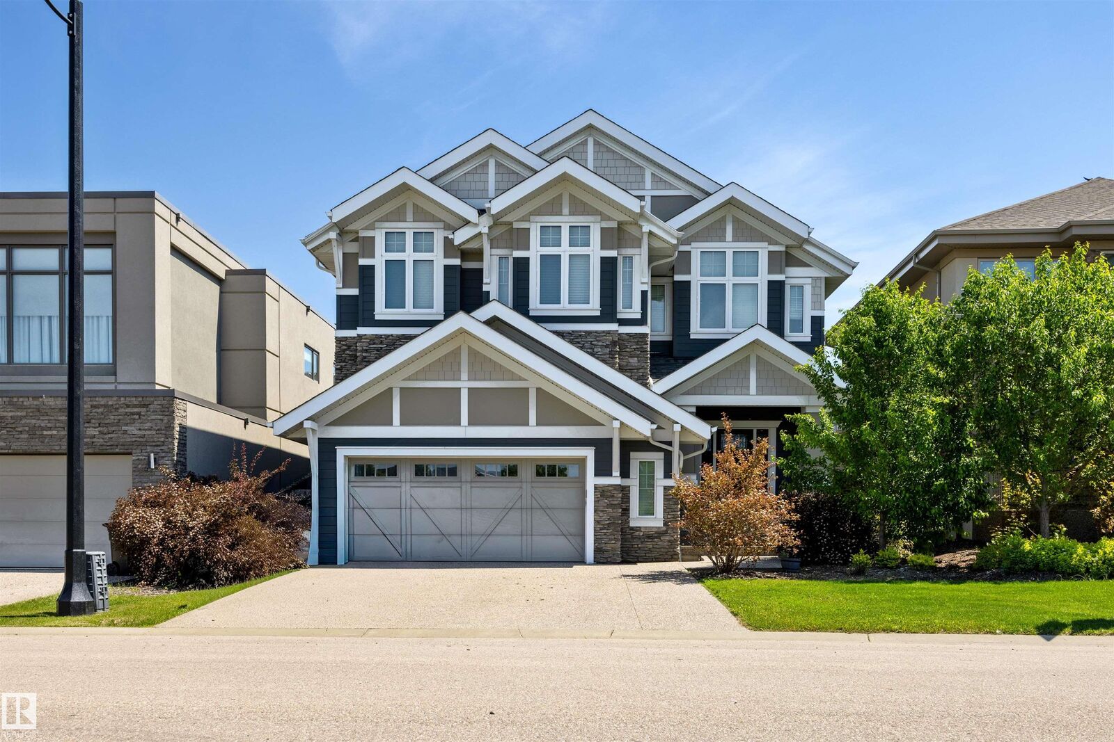 Property Photo: 1305 Hainstock Way SW AB T6W 3B6