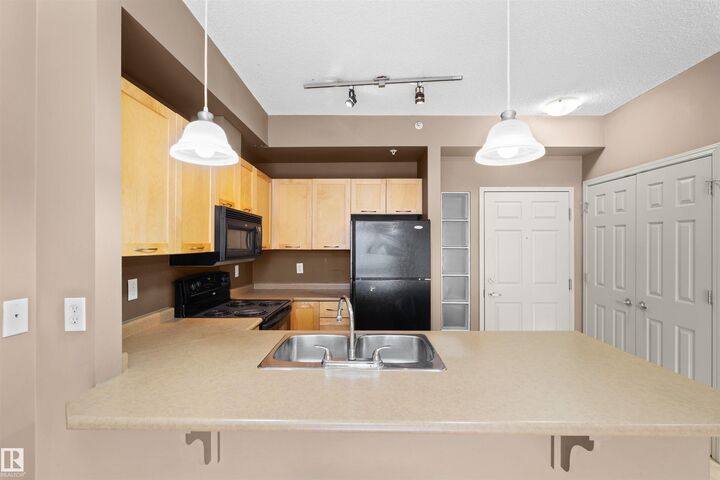 Property Photo: 4245 139 Avenue NW 1-516 AB T5Y 3E8