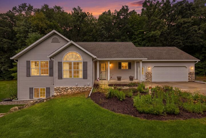 Property Photo:  5075 Bonasa Drive NE  MI 49341 