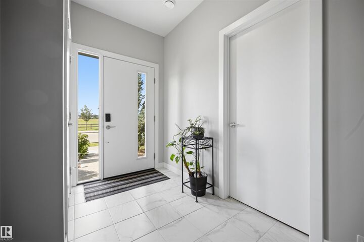 Property Photo: 1119 Keswick Drive SW AB T6W 4B6