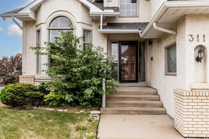 Property Photo: 311 Hawkland Place NW AB T3G 3R4