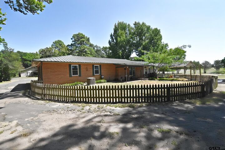 Property Photo: 111 E Oak St TX 75497