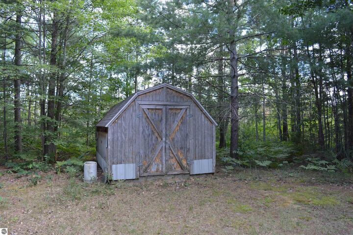 Property Photo:  8430 NE Grass Lake Road  MI 49646 