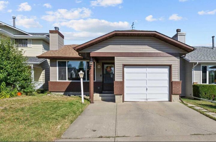 Property Photo:  12 Cedargrove Road SW  AB T2W 4T9 