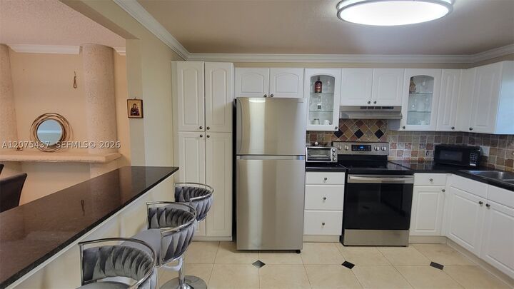 Property Photo:  2410 Deer Creek Country Club Blvd 310E  FL 33442 