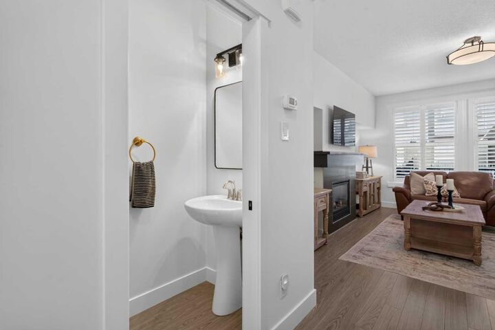 Property Photo: 110 Coopers Common SW 202 AB T4B 3Y3