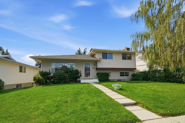 Property Photo: 299 Woodside Circle SW AB T2W 3K2