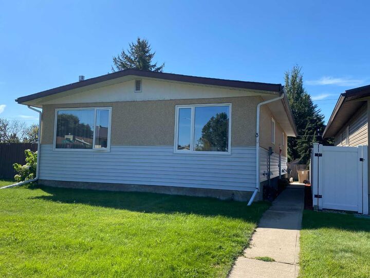 Property Photo: 3 Lake Bevan Drive E AB T1R 0L3