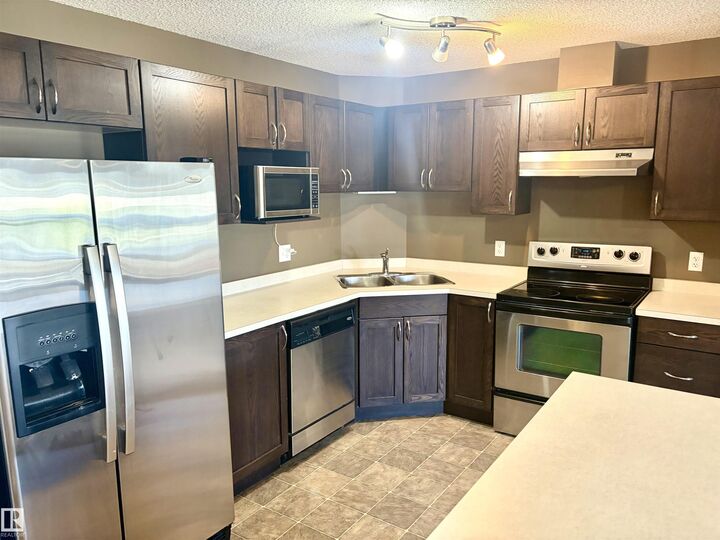 Property Photo: 9363 Simpson Drive NW 1304 AB T6R 0N2