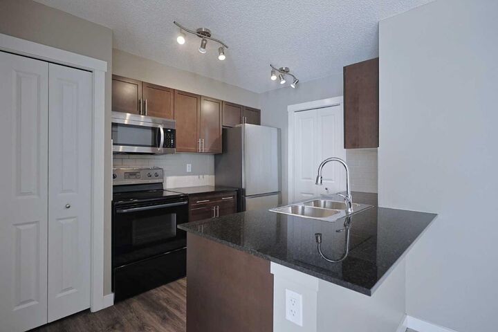 Property Photo: 10 Kincora Glen Park NW 305 AB T3R 1K1