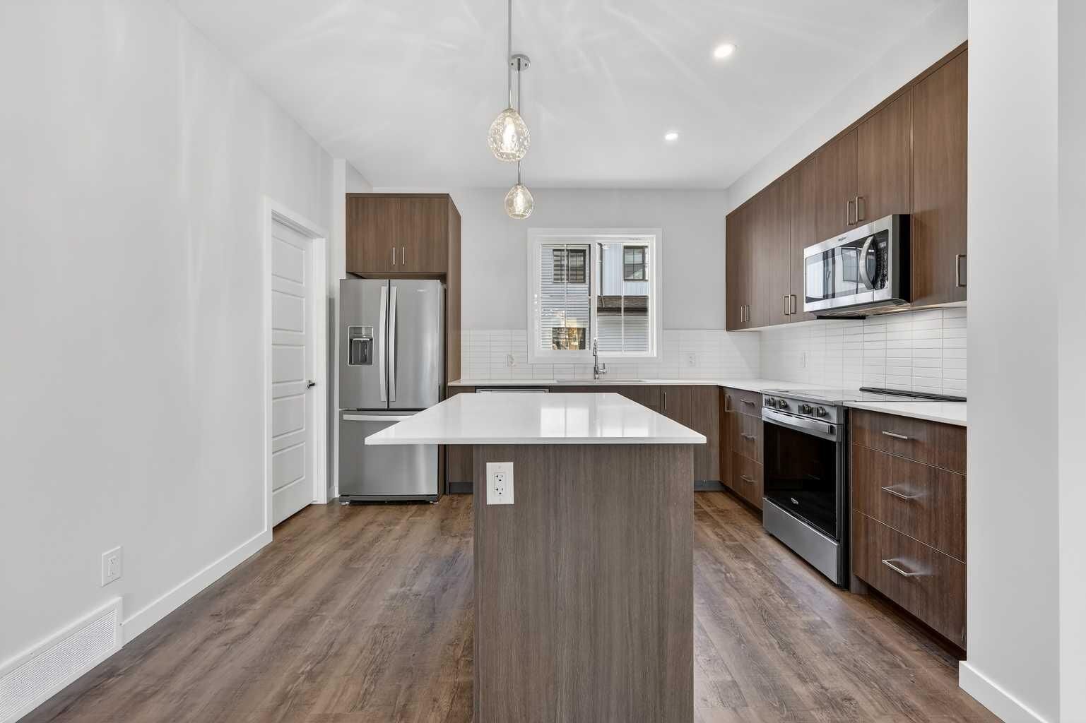 Property Photo:  1750 Rangeview Drive SE 205  AB T3S 0X3 
