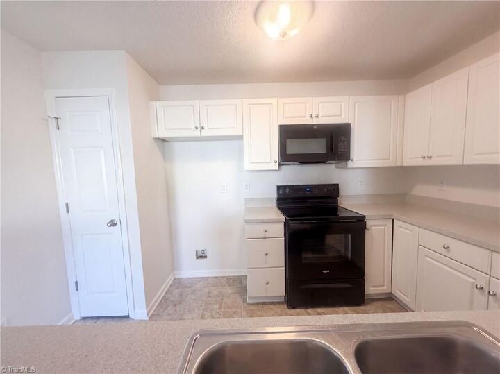 Property Photo: 3721 Morris Farm Drive 1C NC 27409