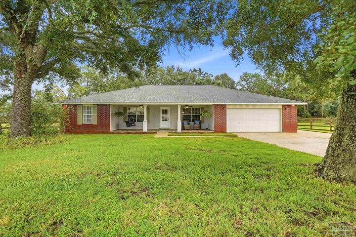 Property Photo: 708 Mike Gibson Ln FL 32583