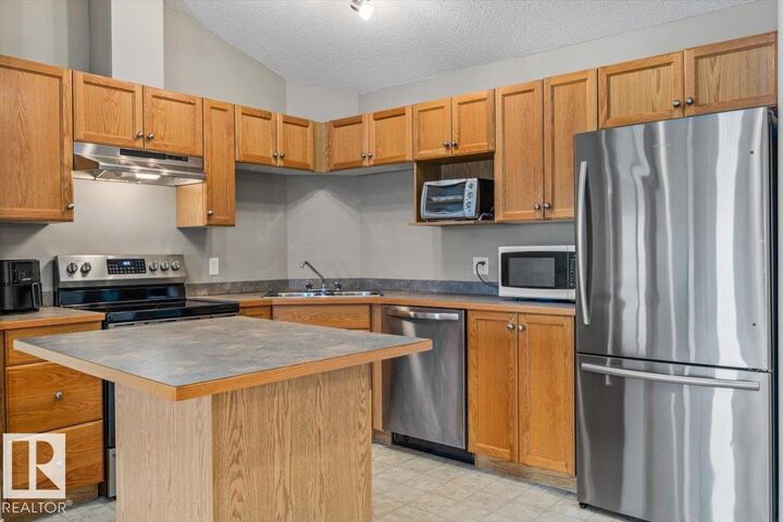 Property Photo: 5340 199 Street NW 402 AB T6M 0A5