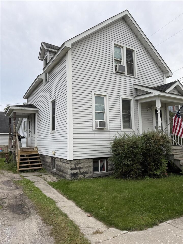 Property Photo:  210 S 7th Avenue  MI 49707-2524 