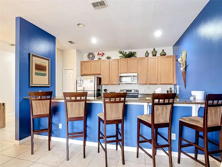 Property Photo:  8956 Candy Palm Road  FL 34747 