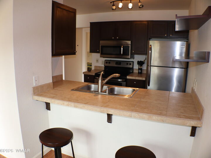 Property Photo:  93 E White Mountain Boulevard Unit 223  AZ 85935 
