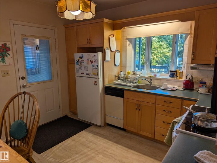 Property Photo:  10965 76 Avenue NW  AB T6G 0J6 