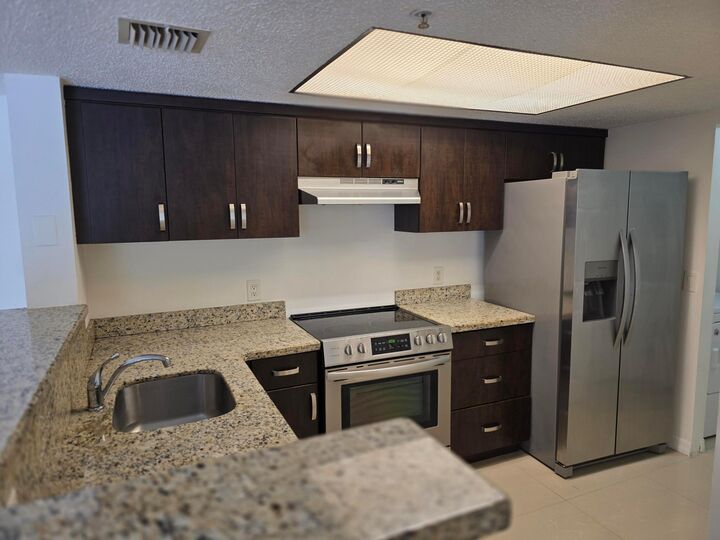 Property Photo:  5055 Wiles Road 207  FL 33073 