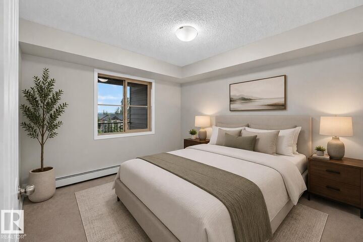 Property Photo:  12025 22 Avenue SW 404  AB T6W 2Y1 