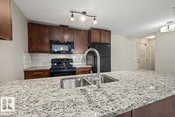 Property Photo: 6076 Schonsee Way NW 230 AB T5Z 0K8