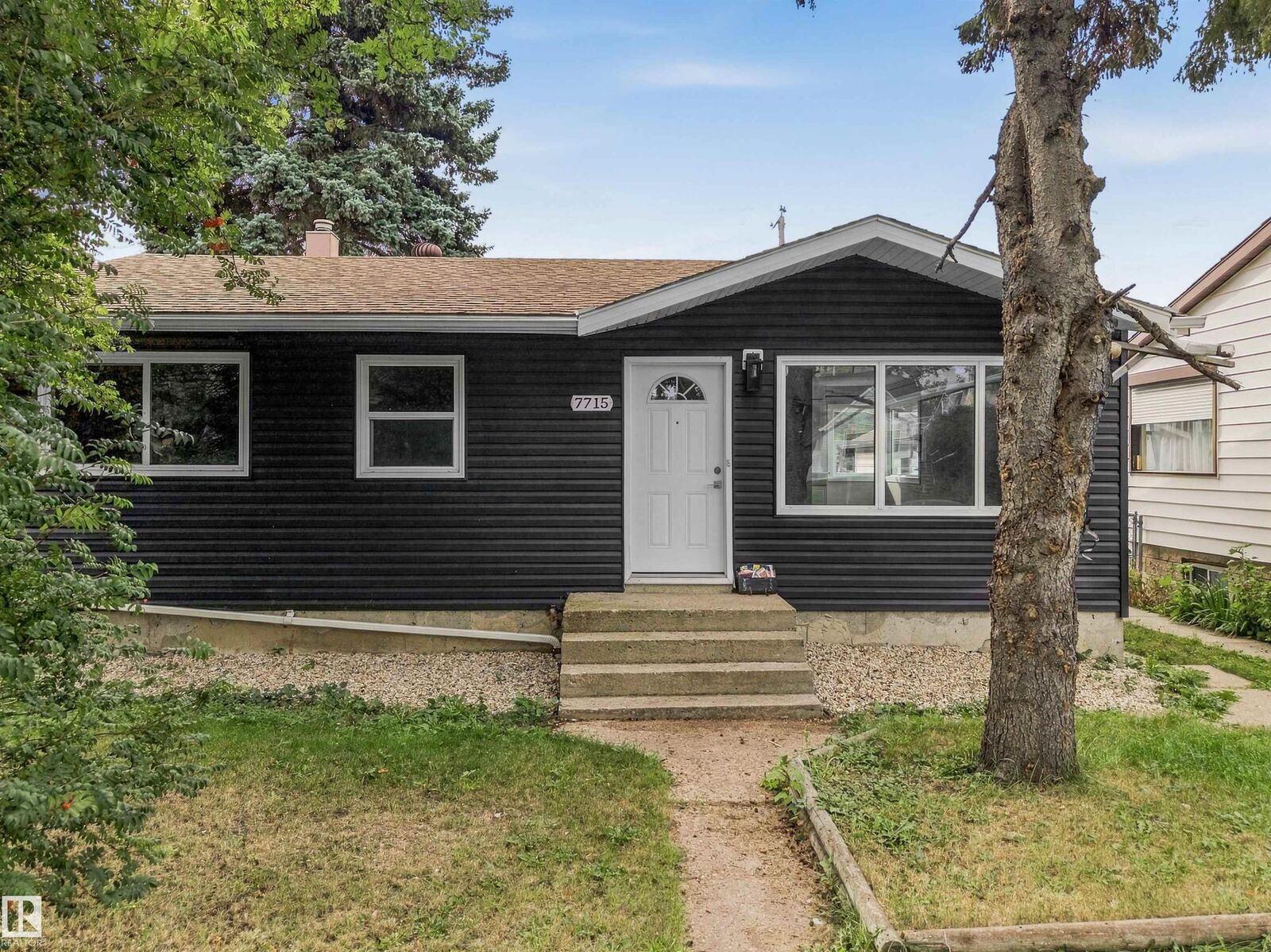 Property Photo:  7715 76 Avenue NW  AB T6C 0H3 